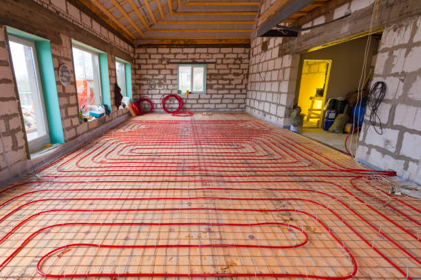 Pipefitter installing system of heating or underfloor heating installation.